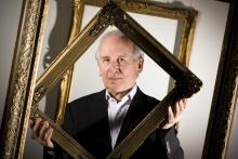 Charles Hewitt with some of his works